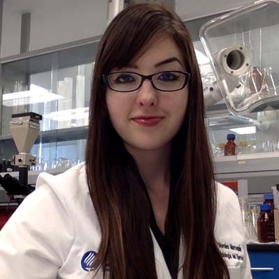 Dr. Morales-Marroquin wearing glasses in the laboratory.