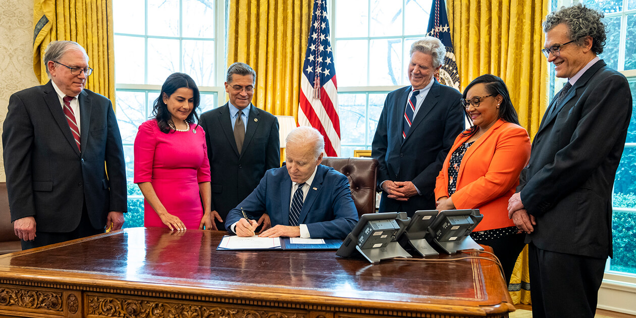 NIMHD Director Dr. Pérez-Stable, NIH Acting Director Dr. Tabak, HHS Secretary Becerra, Congressional leaders with President Biden signing the John Lewis NIMHD Research Endowment Revitalization Act of 2021