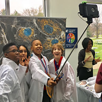 Students taking a picture of themselves as they attend Science Day.