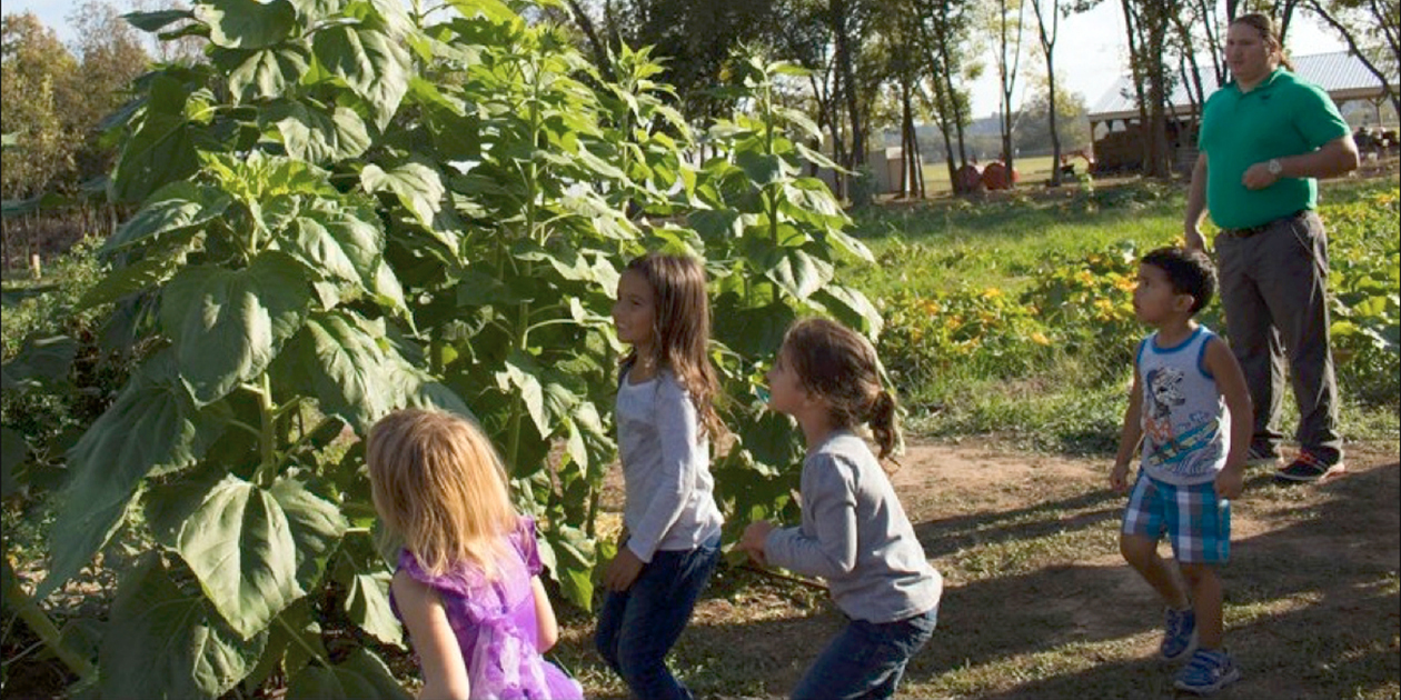 Osage children at a farm