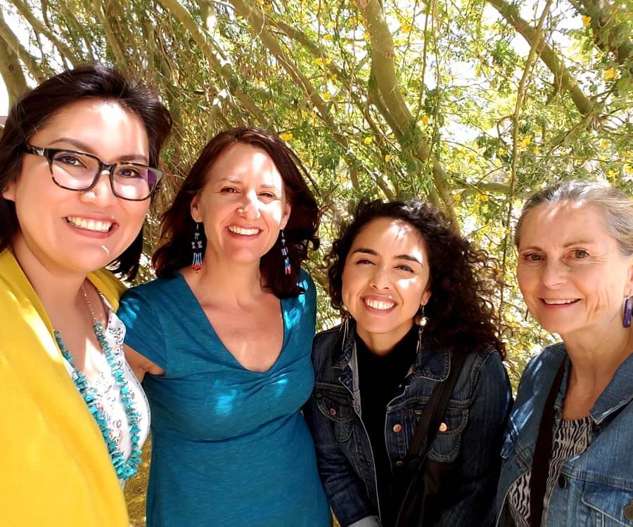 Four female community health researchers and professionals posing for a photo.