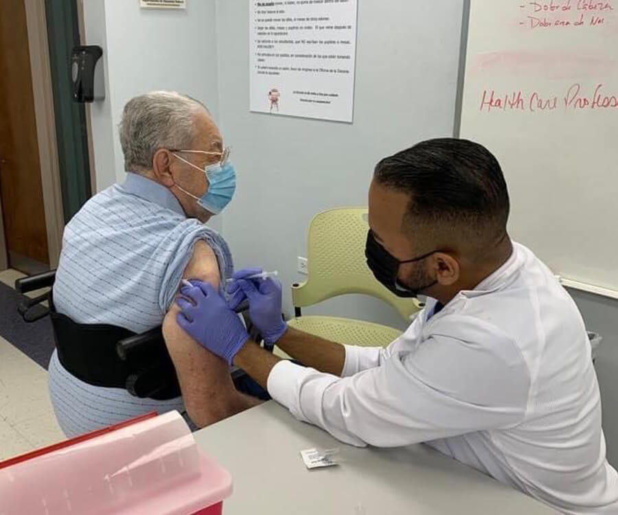 Older male getting the COVID-19 vaccine at the University of Puerto Rico, Medical Sciences Campus. Photo credit: Emma Fernandez