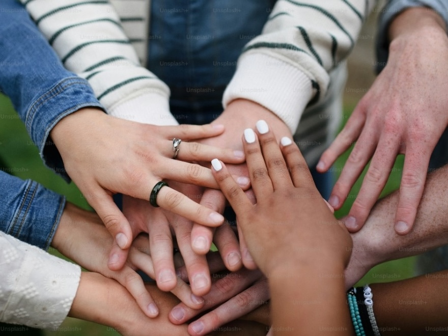 Picture of hands coming together.