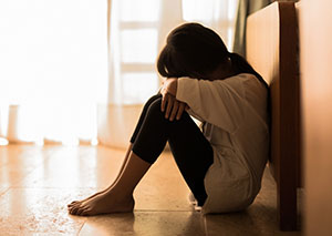 Seated girl looking sad or depressed