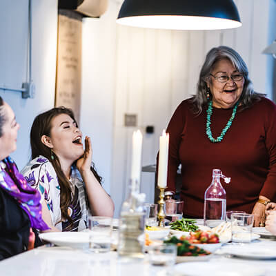Photo of family enjoying dinner