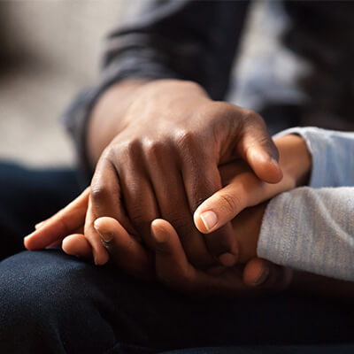 A couple holding hands